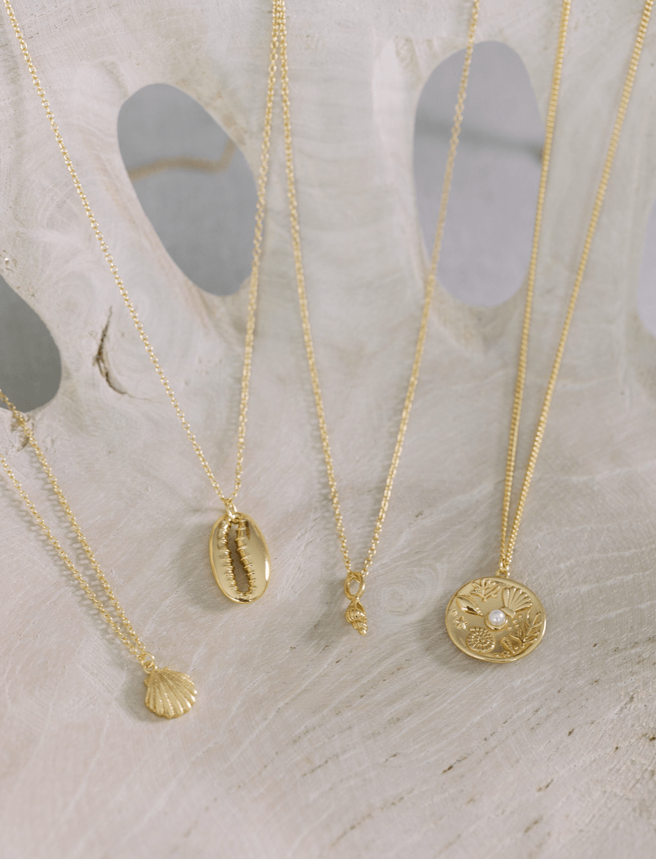 Halsband med kors i guld och kristall