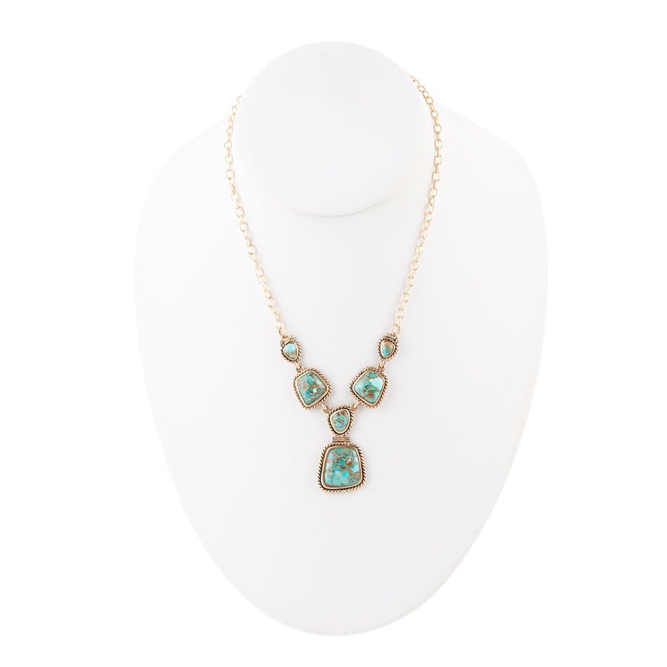 Collana dorata con turchese blu cielo e terra