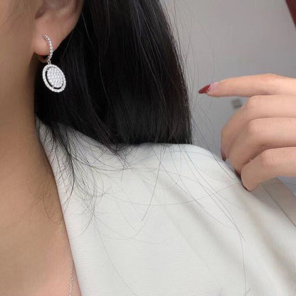 Orecchini ovali in oro bianco - Eleganza alla moda per ogni occasione