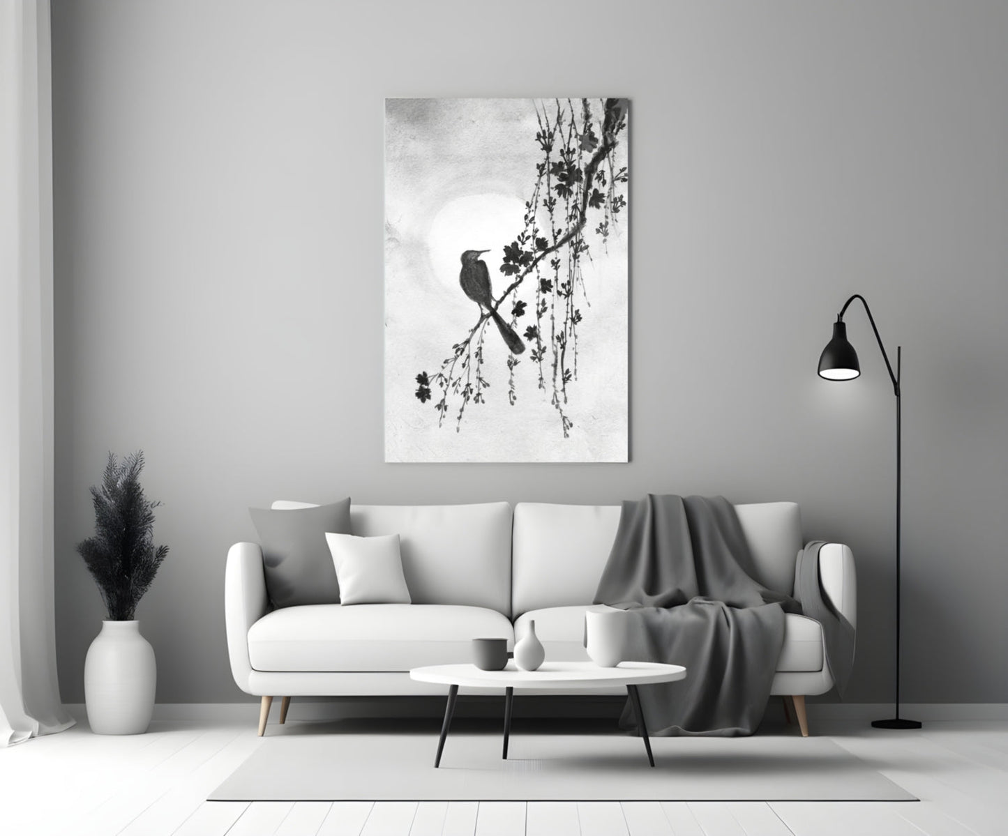 Modern living room with a white sofa, coffee table, and decorative wall art.