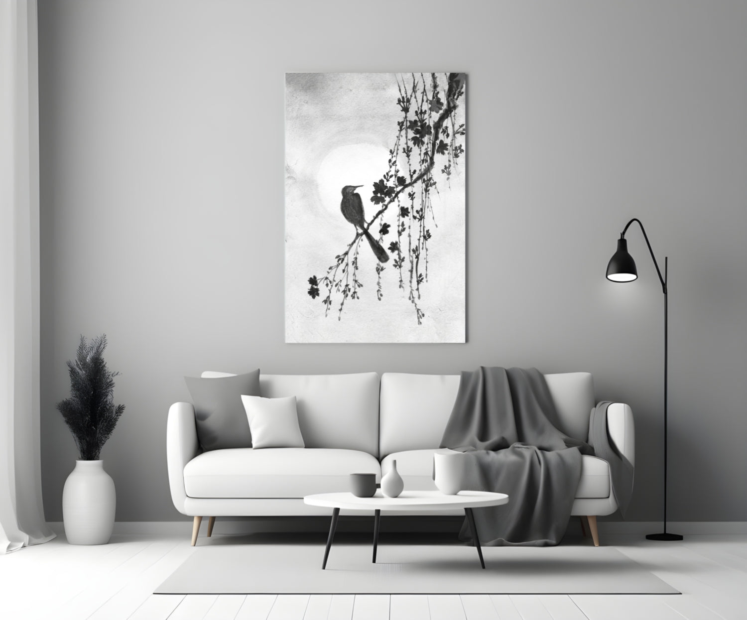Modern living room with a white sofa, coffee table, and decorative wall art.