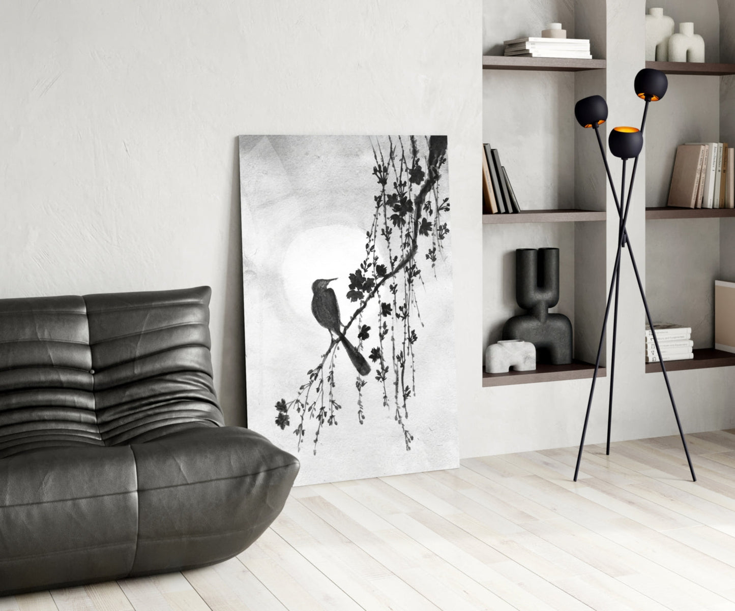Modern living room with a gray armchair, abstract artwork, and decorative shelves.