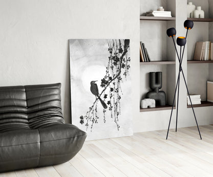 Modern living room with a gray armchair, abstract artwork, and decorative shelves.