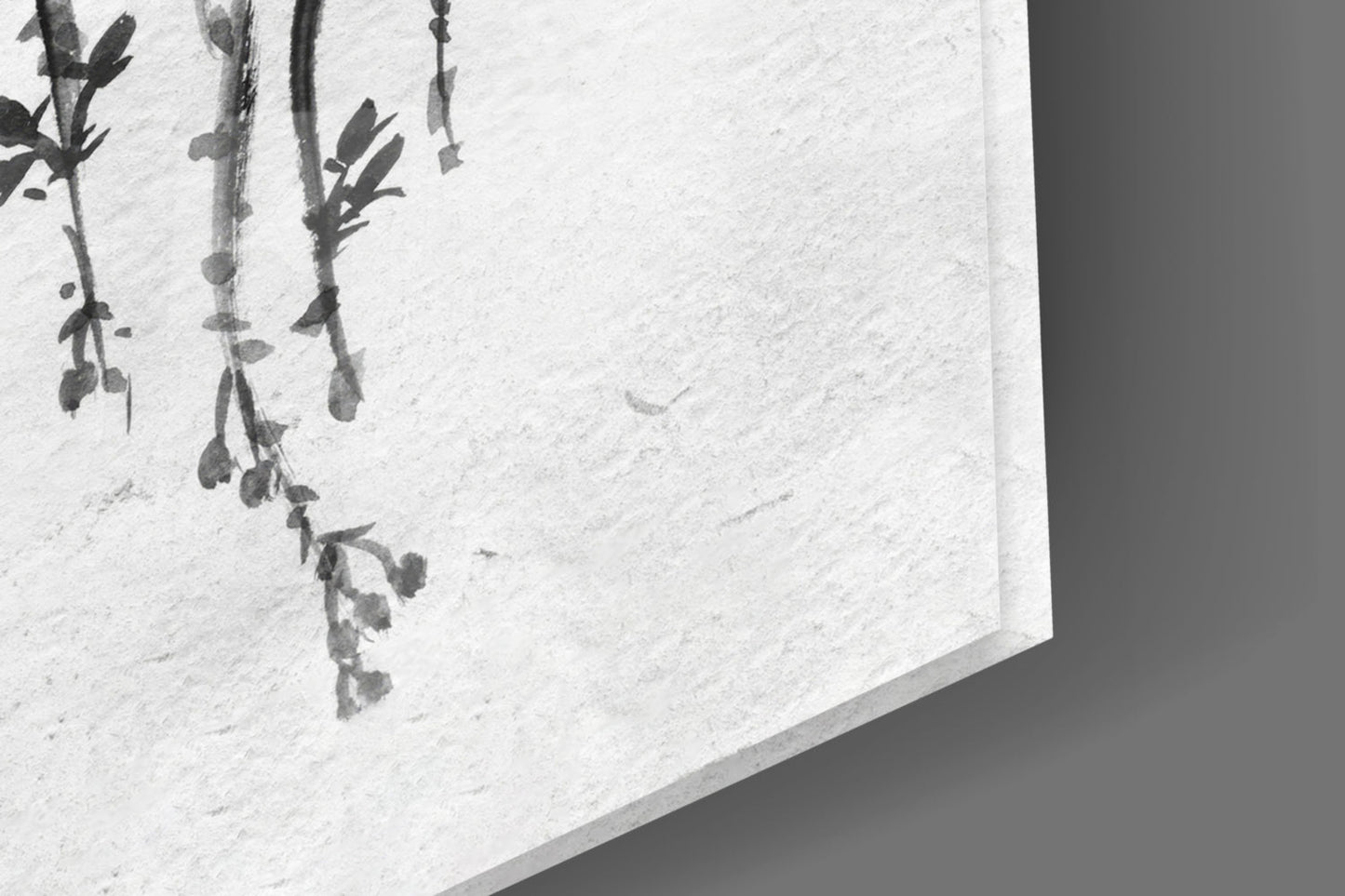 Close-up of a traditional Chinese ink painting on tempered glass with willow branches.