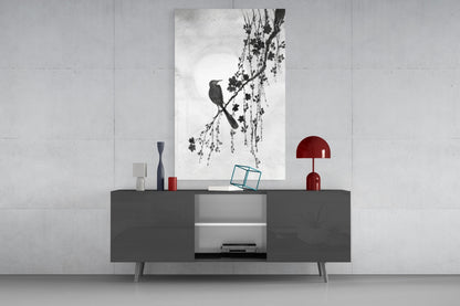 Modern interior with a gray cabinet, red lamp, and glass wall art on a white wall.
