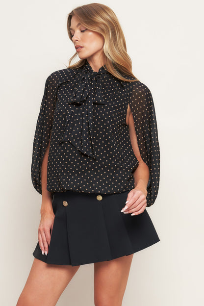 Top intrecciato chic a pois di mezzanotte