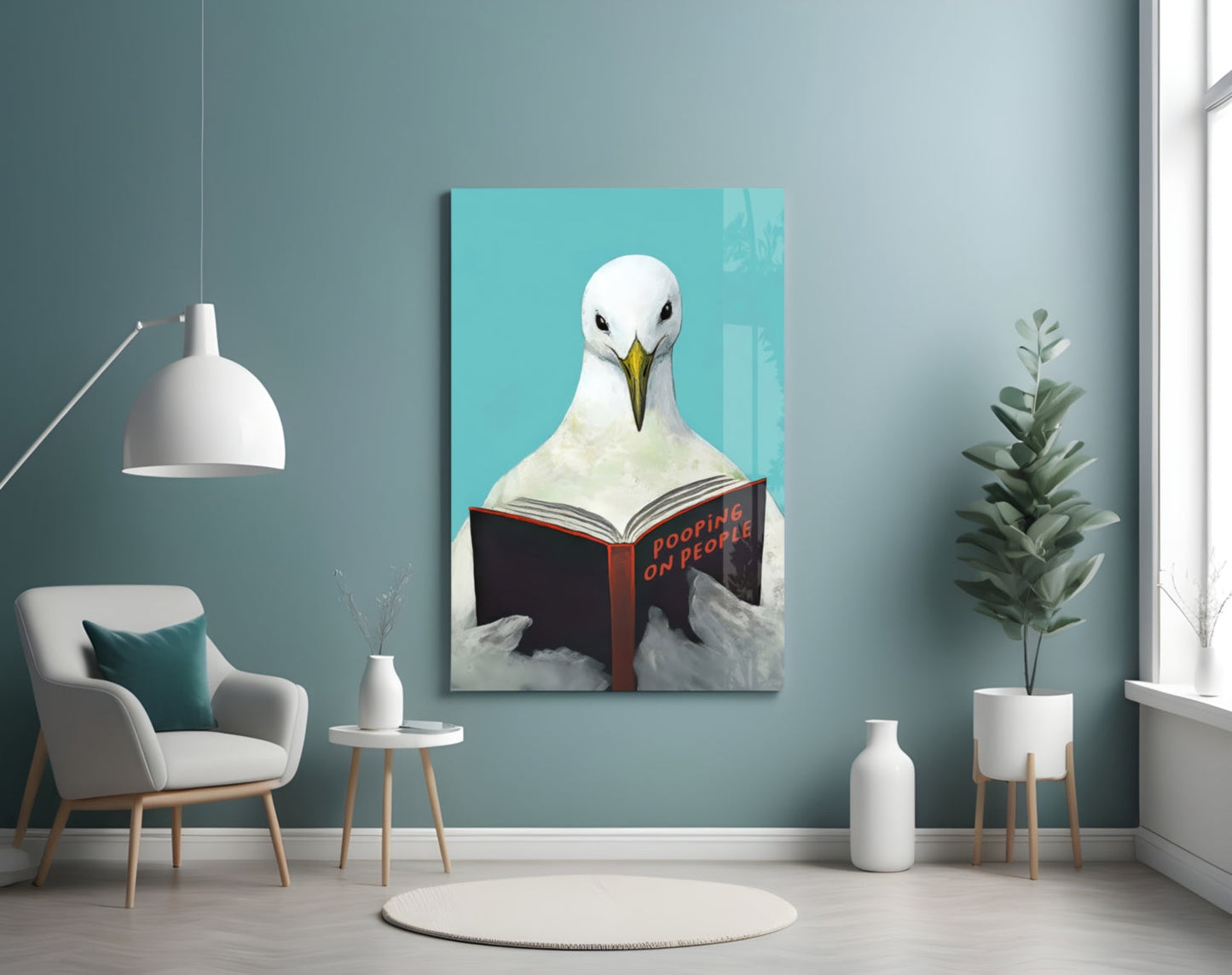 Œuvre murale en verre représentant une mouette lisant un livre sur fond Turquoise