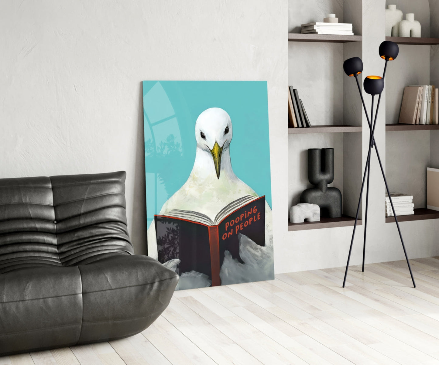 Œuvre murale en verre représentant une mouette lisant un livre sur fond Turquoise