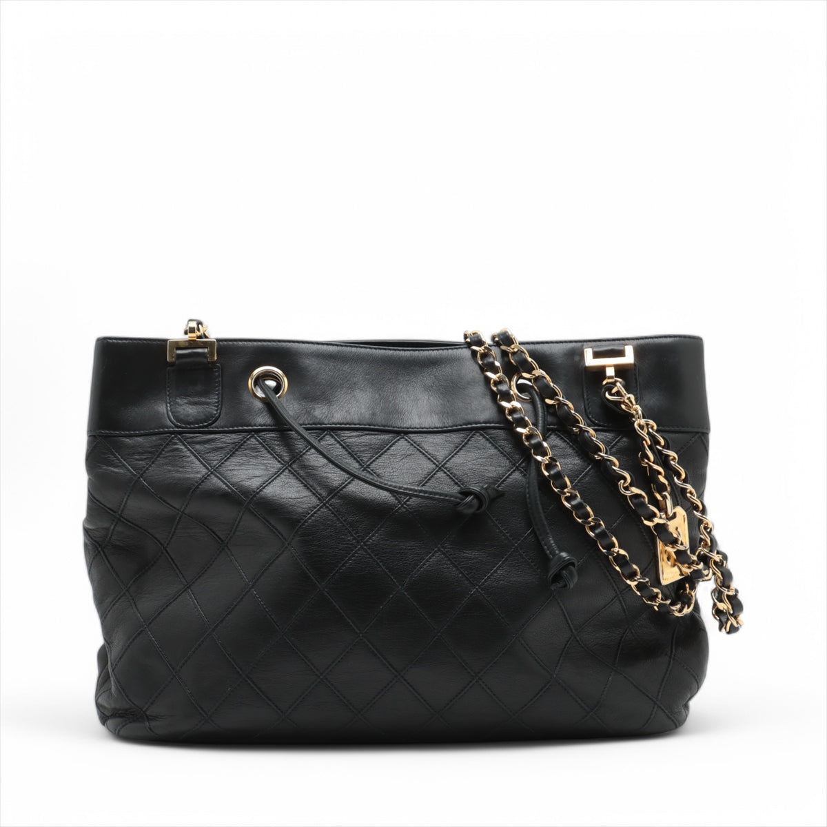 Black quilted handbag with gold chain strap on a white background