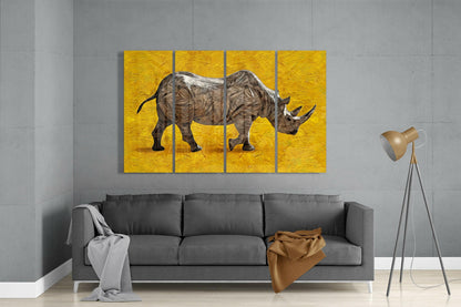 Three-panel wall art of a rhinoceros on a yellow background in a living room.