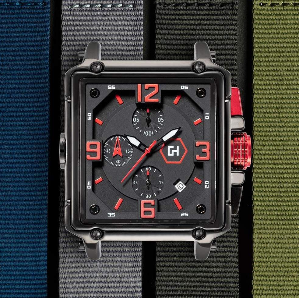 Watch with red accents on a strap against a multicolored background