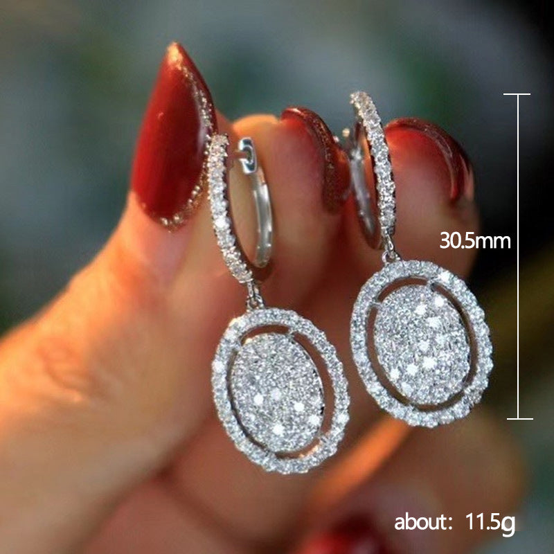 Orecchini ovali in oro bianco - Eleganza alla moda per ogni occasione
