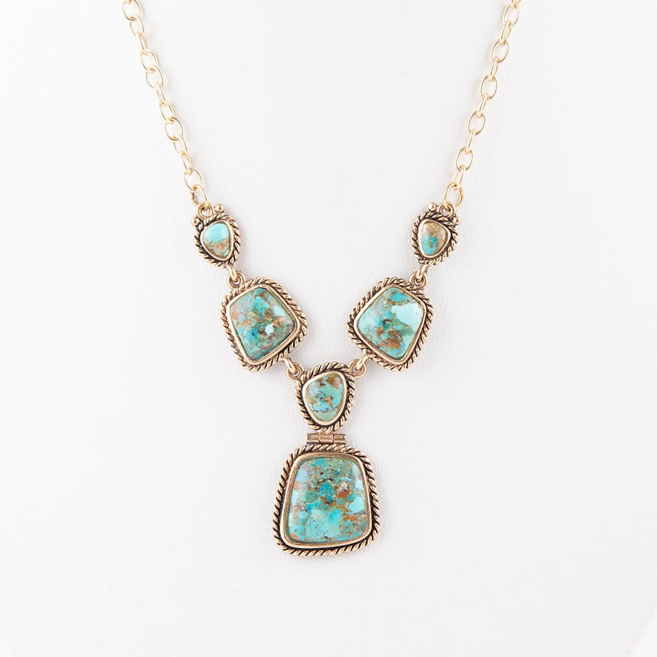 Collana dorata con turchese blu cielo e terra