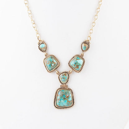 Collana dorata con turchese blu cielo e terra