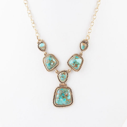 Collana dorata con turchese blu cielo e terra