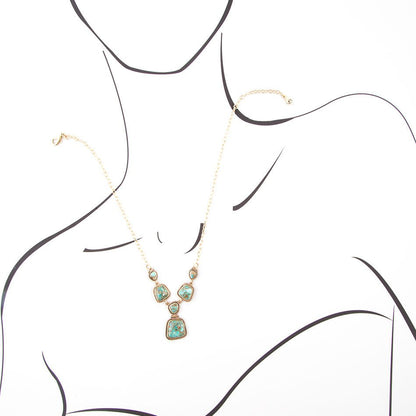 Collana dorata con turchese blu cielo e terra