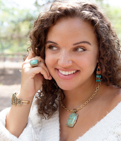 Collana con pendente jacquard blu turchese dorato