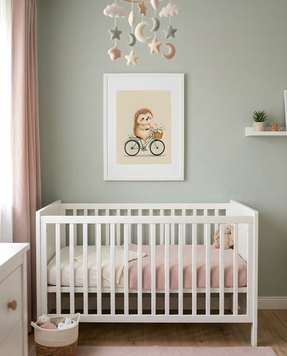 Nursery Retro Flat Hedgehog Bicycle Printable Wall Art — framed in white above a crib in a softly lit nursery