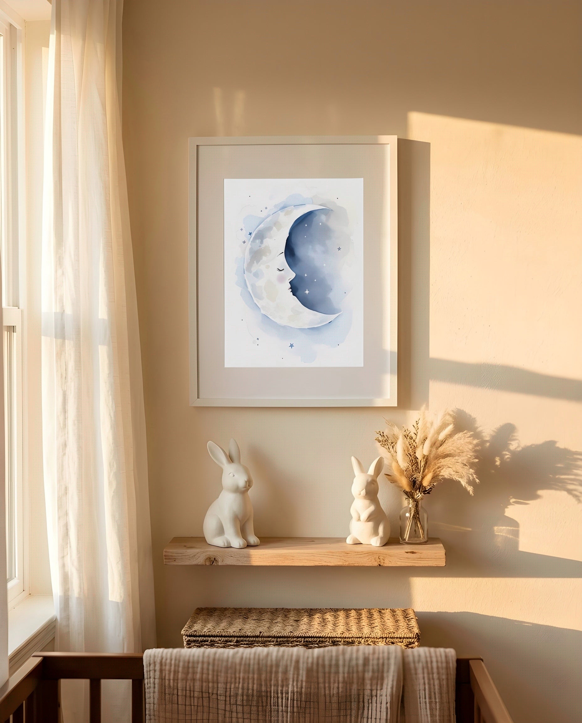 Nursery Sleeping Moon Soft Watercolor Minimal Printable Wall Art — framed in white on a neutral nursery wall