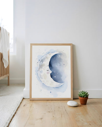 Nursery Sleeping Moon Soft Watercolor Minimal Printable Wall Art — leaning against a wall in a styled setting