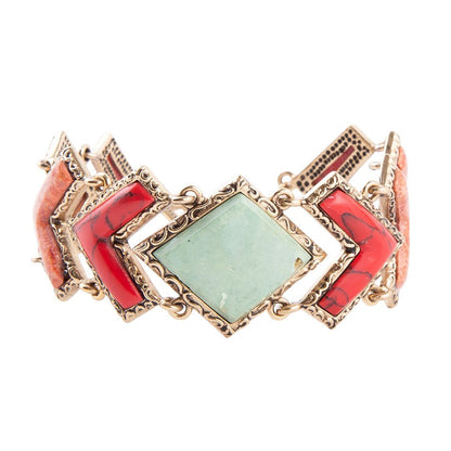Bracciale a catena dorata con arazzo di turchese verde e corallo